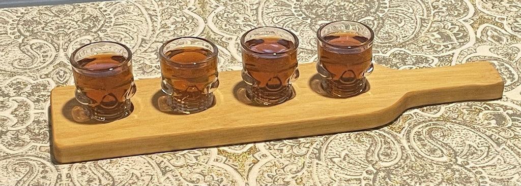 Whiskey flight with skull glasses